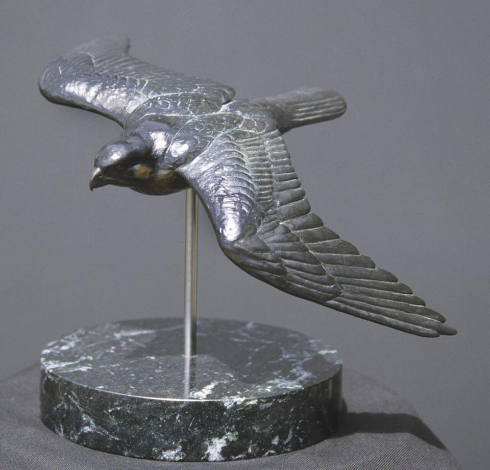 Peregrine in Flight, a bronze sculpture by Robert Bateman.