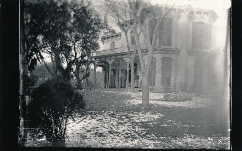 Flower Hill as it looked in the 1870s before the white columns were added to the front.