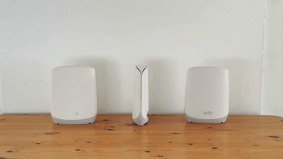 Netgear Orbi RBK763 on a wooden table