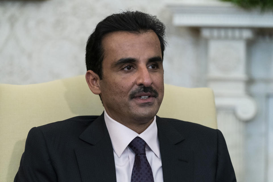 Qatar's Emir Sheikh Tamim bin Hamad Al Thani speaks during a meeting with President Joe Biden in the Oval Office of the White House, Monday, Jan. 31, 2022, in Washington. (AP Photo/Alex Brandon)