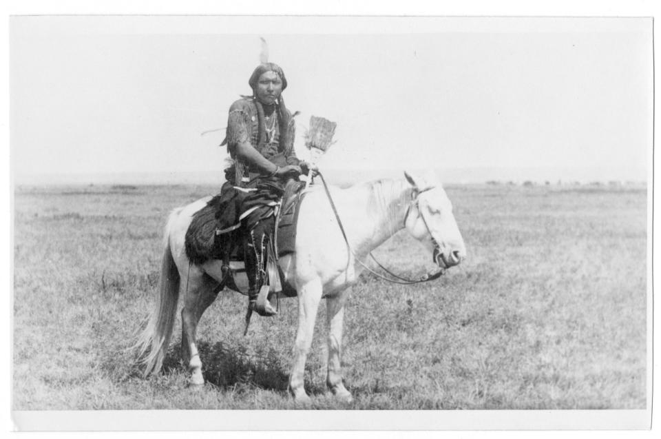 A Native American sitting on a horse on the early Plains.