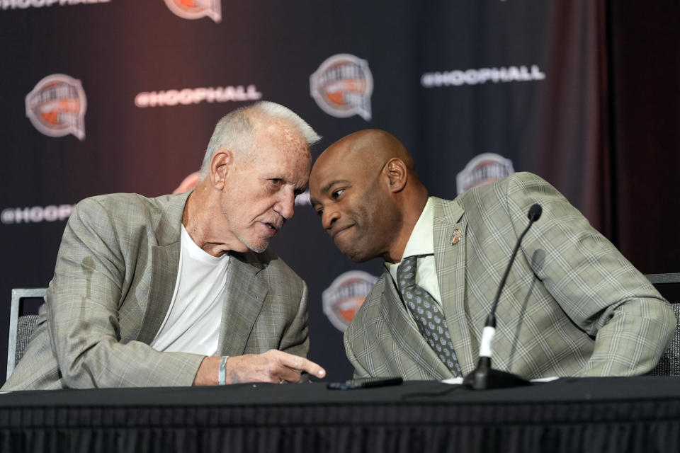 Doug Collins, left, taks with Vince Carter during a news conference for The Naismith Basketball Hall of Fame at the NCAA college basketball Tournament on Saturday, April 6, 2024, in Phoenix. (AP Photo/David J. Phillip)