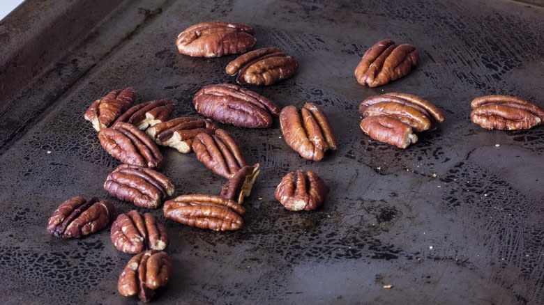 toasted pecans on baking sheet