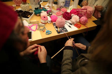 Knitters take part in the Pussyhat social media campaign to provide pink hats for protesters in the women's march in Washington, D.C., the day after the presidential inauguration, in Los Angeles, California, U.S., January 13, 2017. REUTERS/Lucy Nicholson