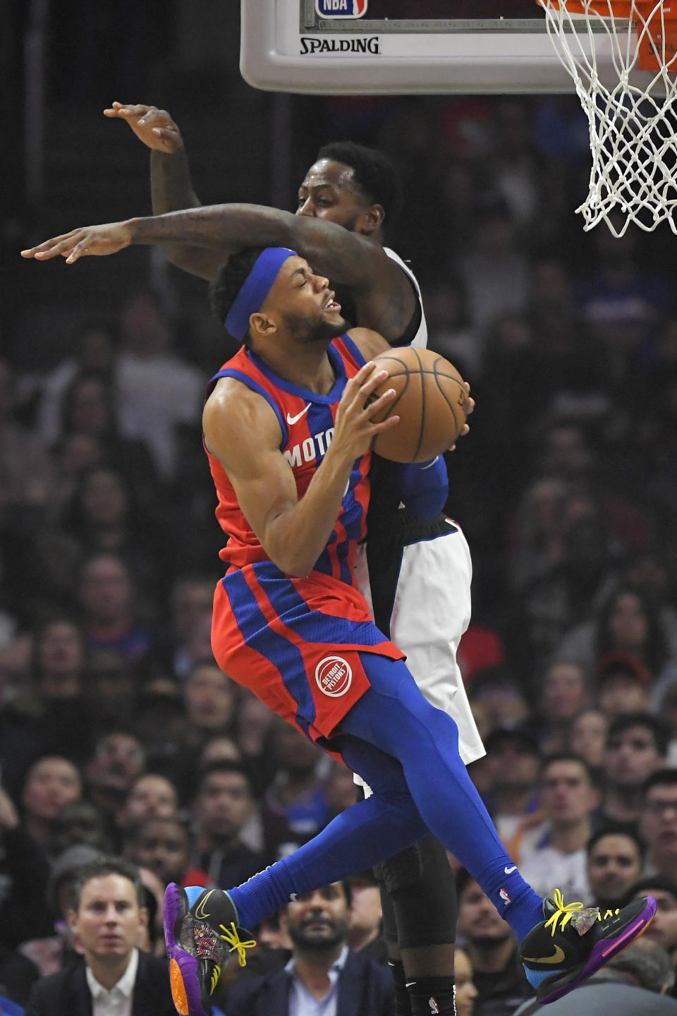 Detroit Pistons guard Bruce Brown, left, shoots as Los Angeles Clippers forward JaMychal Green defends during the first half of an NBA basketball game Thursday, Jan. 2, 2020, in Los Angeles. (AP Photo/Mark J. Terrill)
