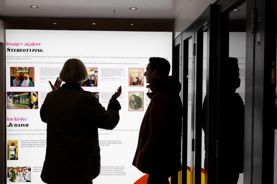 Visitors explore the National Holocaust Museum's touring exhibition outside Hampstead Theatre. (David Parry)