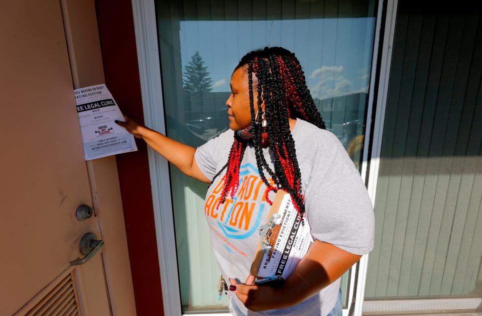 With no tenant to answer the door, Tenesa Sanders, 48 of Detroit and the lead organizer for Detroit Action, has to leave a legal help flyer  on Saturday, October 9, 2021 for those facing eviction in Detroit.