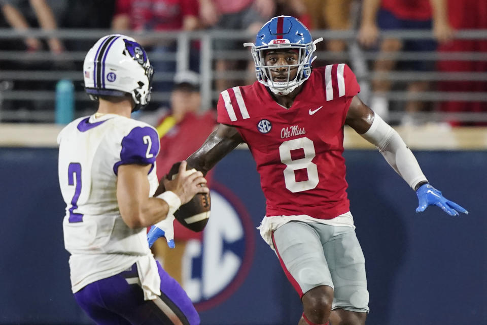 Mississippi linebacker Troy Brown (8) pressures Central Arkansas quarterback Will McElvain (2) who attempts to pass during the first half of an NCAA college football game in Oxford, Miss., Saturday, Sept. 10, 2022. (AP Photo/Rogelio V. Solis)