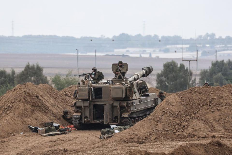 Soldiers man a tank near the Israel-Gaza border.