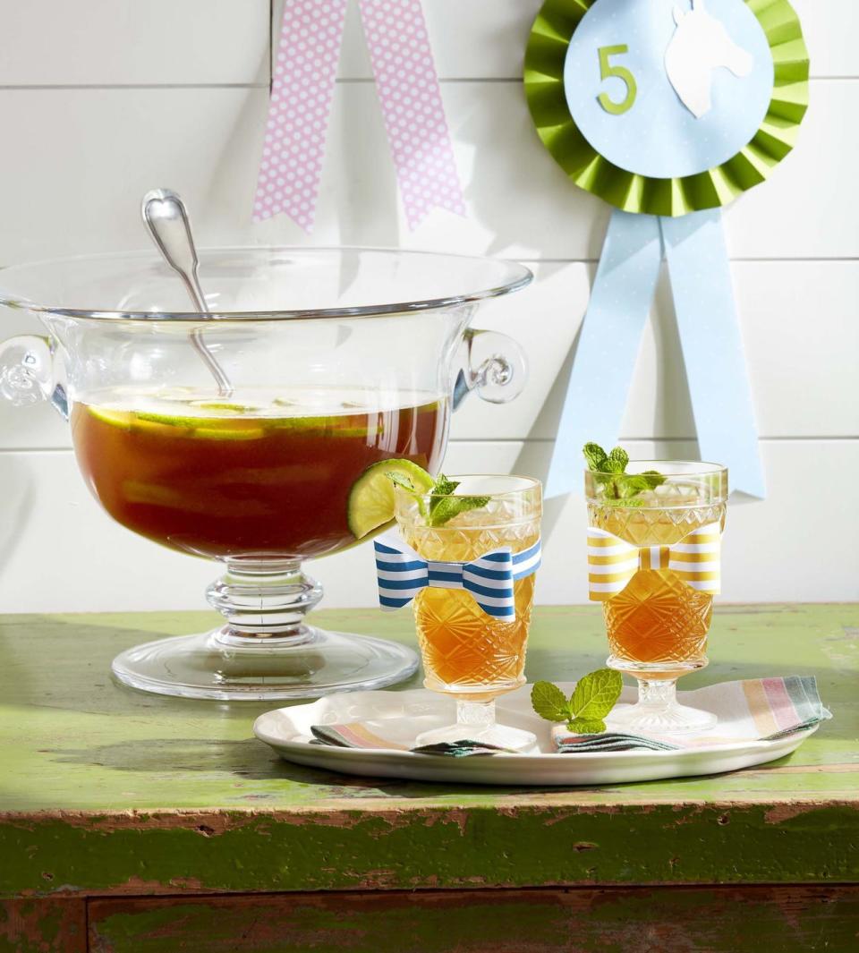 <p>Want to make all your cocktails at once? Get a punch bowl and stir up this Derby cocktail. Guests can help themselves, and you can spend less time with a shaker and more time mingling.</p><p><strong><a href="https://www.countryliving.com/food-drinks/a32042835/bourbon-derby-punch/" rel="nofollow noopener" target="_blank" data-ylk="slk:Get the recipe;elm:context_link;itc:0;sec:content-canvas" class="link ">Get the recipe</a>.</strong> </p>