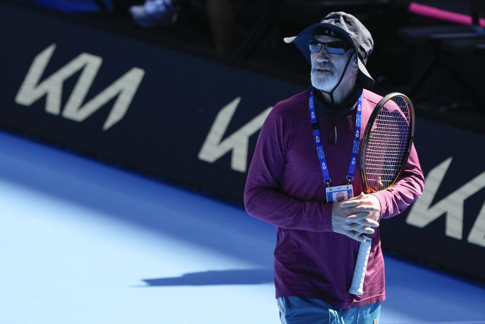 Brad Gilbert, coach of Coco Gauff of the United States watches her practice on Rod Laver Arena ahead of the Australian Open tennis championships at Melbourne Park, Melbourne, Australia, Thursday, Jan. 11, 2024. (AP Photo/Mark Baker)
