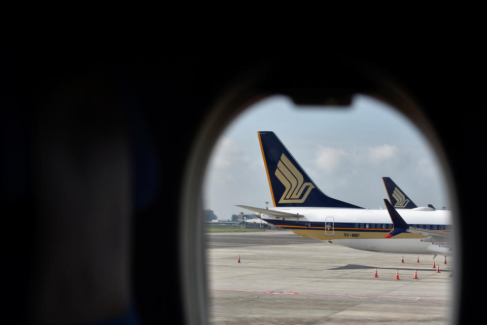 Singapore Airlines planes sit on the tarmac at Changi Airport in Singapore November 16, 2021. REUTERS/Caroline Chia