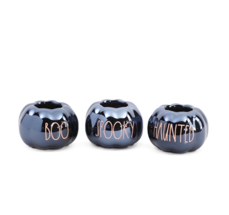 <p><strong>Rae Dunn</strong></p><p><strong>$19.99</strong></p><p><a href="https://tjmaxx.tjx.com/store/jump/product/Set-Of-3-Pumpkin-Tea-Light-Holders/1000711020" rel="nofollow noopener" target="_blank" data-ylk="slk:Shop Now" class="link ">Shop Now</a></p><p>Okay, technically not candles, but how could we resist these adorable — and affordable — tea light holders from Rae Dunn? We recommend putting <a href="https://www.amazon.com/Tappovaly-Flameless-Operated-Tealight-Decoration/dp/B07WLLRVMD?tag=syn-yahoo-20&ascsubtag=%5Bartid%7C10055.g.39906103%5Bsrc%7Cyahoo-us" rel="nofollow noopener" target="_blank" data-ylk="slk:battery-operated candles" class="link ">battery-operated candles</a> in 'em. </p>