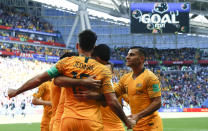 <p>Mile high club! Australia’s Mile Jedinak is Mr Popular as he slotted home his penalty kick (AP) </p>