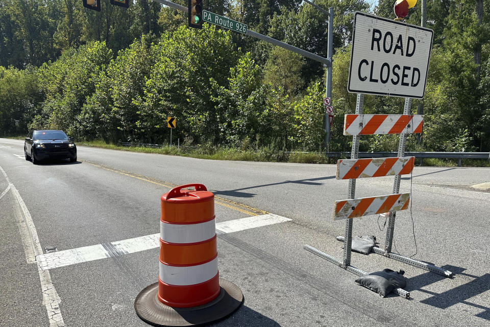 Roads are blocked by officials near Chester County Prison where convicted murderer Danelo Cavalcante escaped last week as they continue to search for him, Wednesday, Sept. 6, 2023, in Pocopson Township, Pa. Officials expanded the zone they're searching for him after he was spotted on cameras at Longwood Gardens, a botanical garden in the area. (AP Photo/Tassanee Vejpongsa)