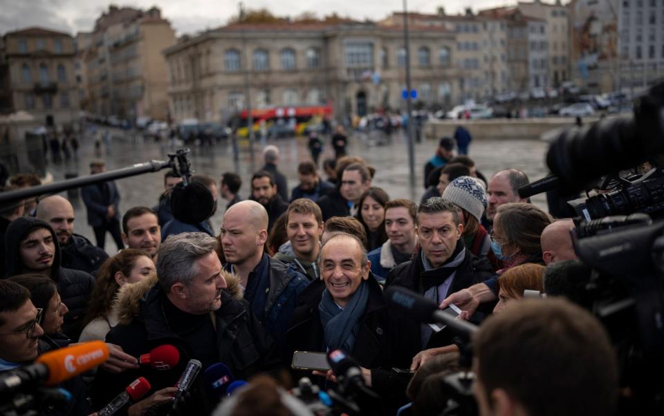 Hard-right political talk-show star Eric Zemmour speaks to media outside of the Major Cathedral in Marseille, southern France - Daniel Cole/AP
