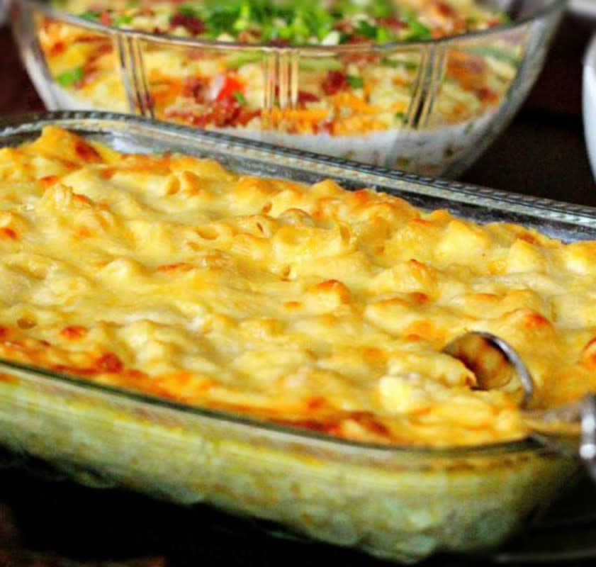 <p>Melissa's Southern Style Kitchen</p><p>Gooey Double Cheddar Macaroni and Cheese can be assembled in advance, then chilled. Bring to room temperature and bake just before serving. <a href="https://www.melissassouthernstylekitchen.com/double-cheddar-macaroni-and-cheese/" rel="nofollow noopener" target="_blank" data-ylk="slk:Get the recipe here;elm:context_link;itc:0;sec:content-canvas" class="link rapid-noclick-resp">Get the recipe here</a>.</p>