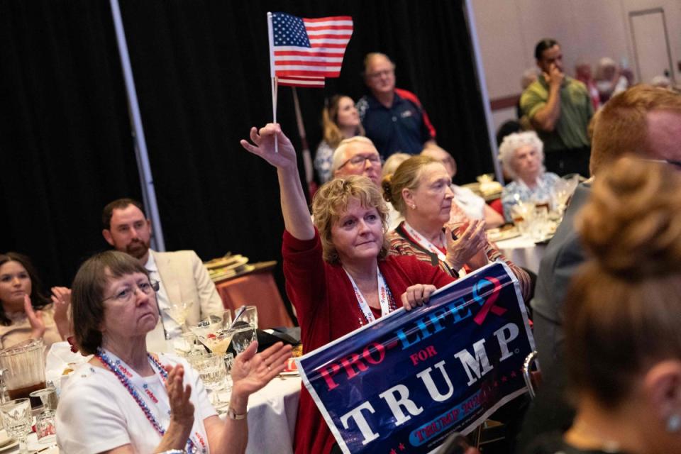 A woman holds a pro-life sign as she listen to Former US President and 2024 Presidential hopeful Donald Trump speak at the North Carolina Republican Party Convention in Greensboro, North Carolina, on June 10, 2023. (Photo by ALLISON JOYCE / AFP) (Photo by ALLISON JOYCE/AFP via Getty Images) (AFP via Getty Images)