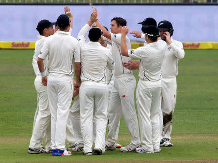 New Zealand celebrate the wicket of South Africa's Stephen Cook during the first cricket test match in Durban, South Africa, August 19, 2016. REUTERS/Rogan Ward