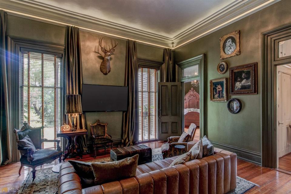 A view of a living room en suite to a bedroom in the infamous Creel House.