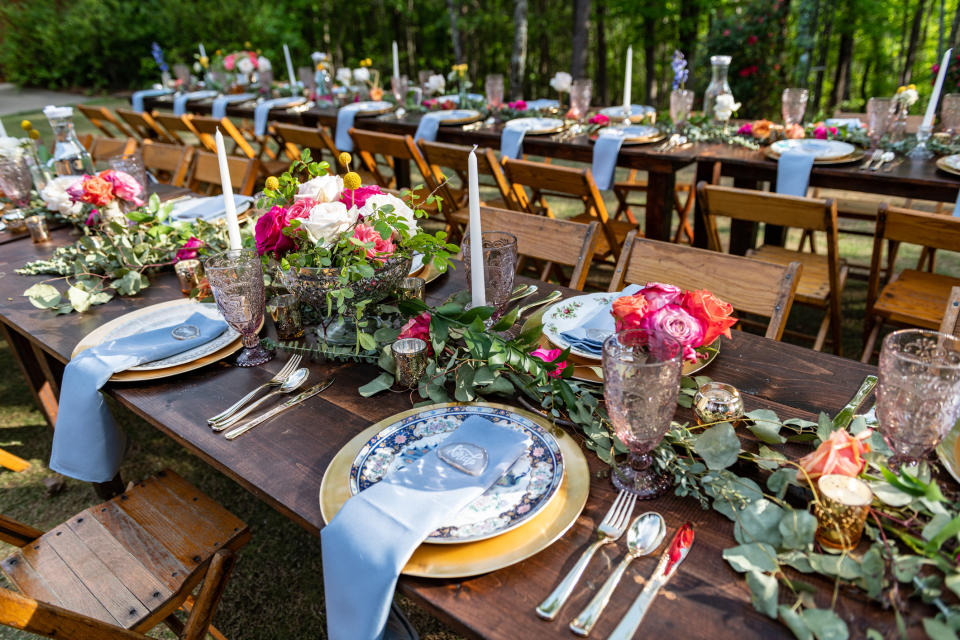 Wedding place settings at an outdoor table.