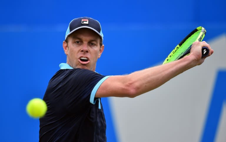 Sam Querrey of the US returns during his men's singles second round match against Australia's Jordan Thompson at the ATP Aegon Championships tennis tournament at the Queen's Club in west London on June 22, 2017
