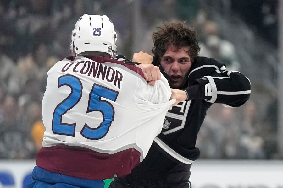 Colorado Avalanche right wing Logan O’Connor, left, and Los Angeles Kings right wing Alex Laferriere fight during the second period of an NHL hockey game Wednesday, Oct. 11, 2023, in Los Angeles. (AP Photo/Mark J. Terrill)