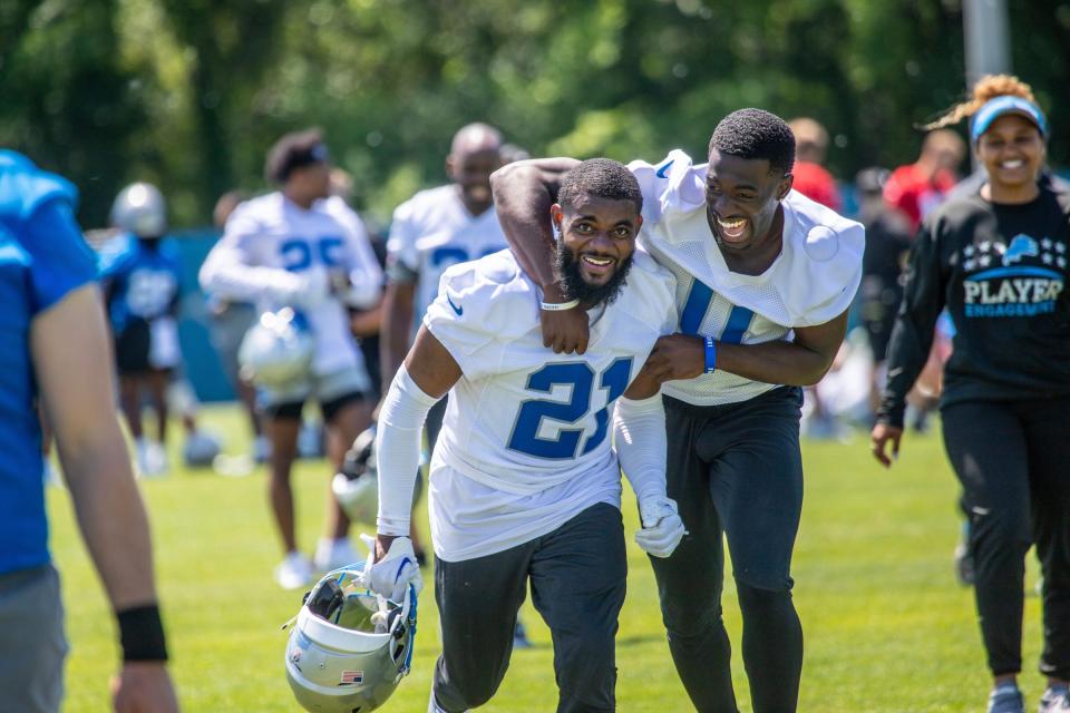 Lions cornerbacks Amik Robertson, left, and Terrion Arnold run off the field after the organized team activities in Allen Park on Thursday, May 23, 2024.