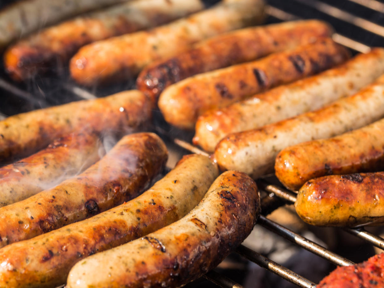 Sausages should be cooked for 20 minutes and reach 70C internally to kill the virus: Getty