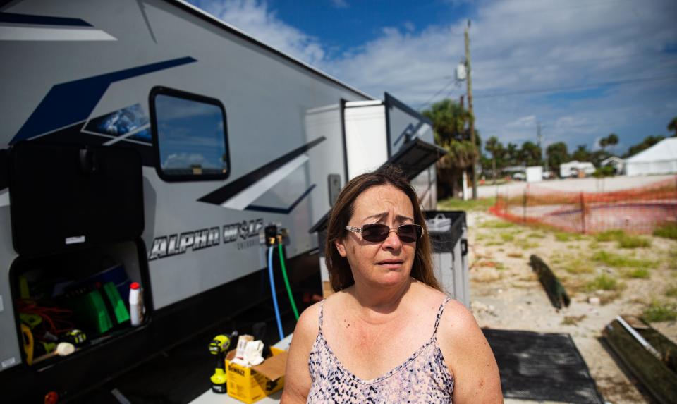 An emotional Christine Willis, a Fort Myers Beach resident prepares to leave the beach in anticipation of the approach of Tropical Storm Idalia on Monday, August 28, 2023. Her home was destroyed in Hurricane Ian and she and her husband, Dewitt lost everything. They said they are not taking any chances and leaving to stay in a hotel until the storm passes.  