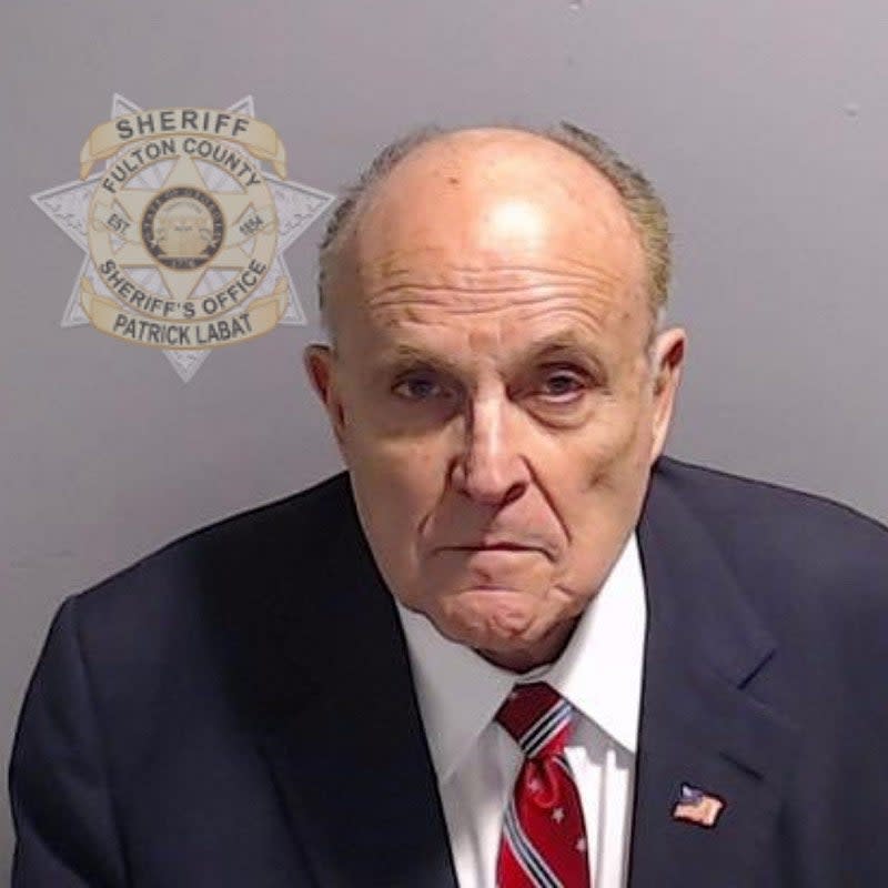 A mugshot of Rudy Giuliani.