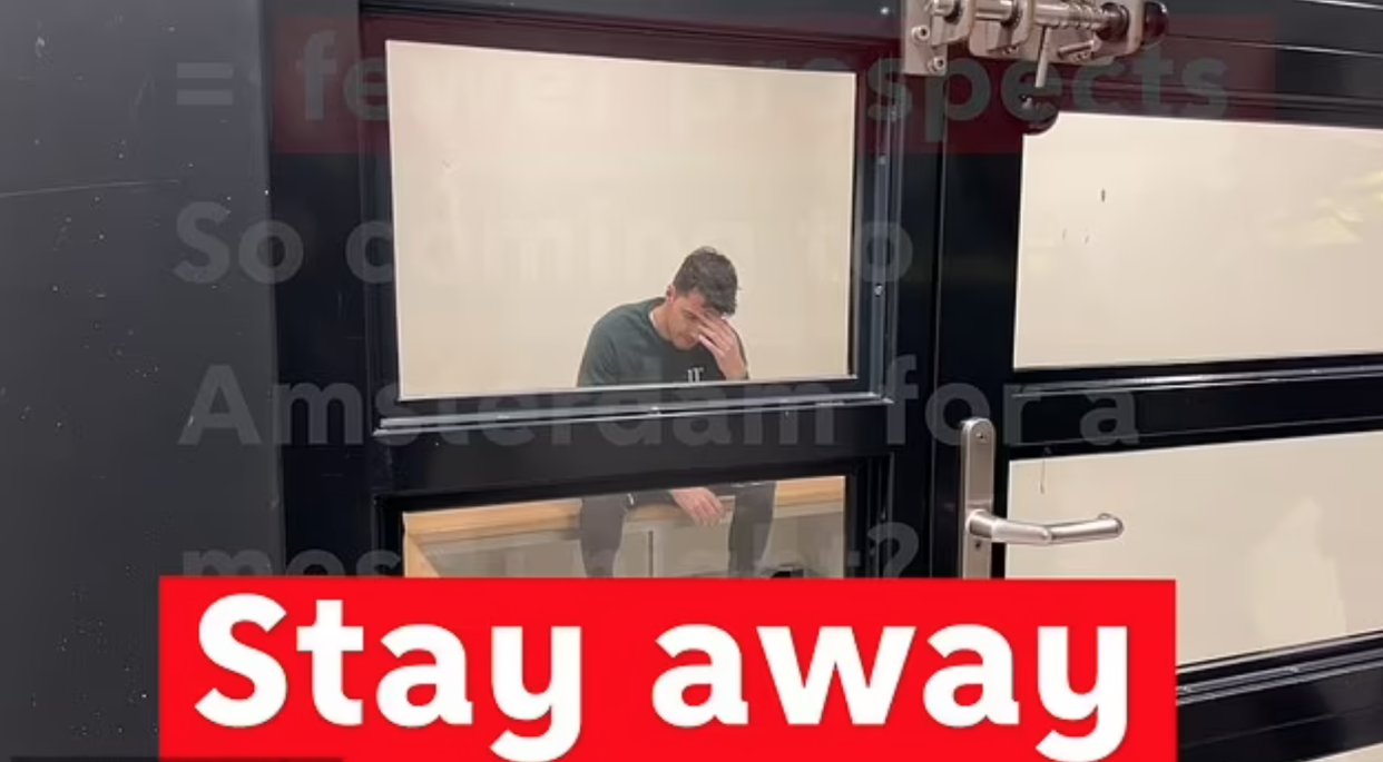 The campaign features a staged video showing a young man being arrested after he was found stumbling along the city's streets. The video is overlaid with red writing which reads: 'So coming to Amsterdam for a messy night? Stay away'