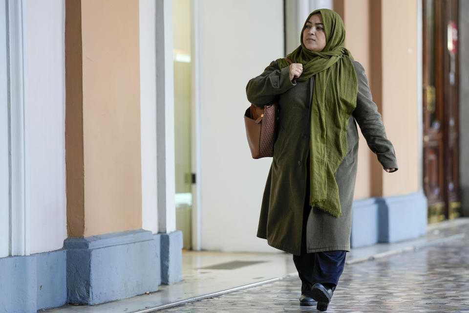 Batool Haidari, 37, walks to her Italian language class, in Rome, Monday, Dec. 5, 2022. Batool Haidari was a prominent professor of sexology at a university in Kabul before last year’s Taliban takeover of Afghanistan. She used to lecture mixed classes of male and female students and look after her patients struggling with their gender identity. That comfortable life came to an abrupt halt on Aug. 15, 2021, when the ultra-religious group swept back into power. (AP Photo/Andrew Medichini)