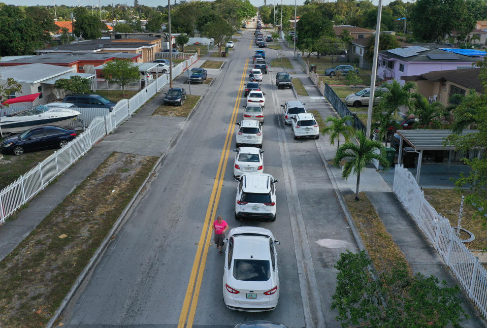 People line up for unemployment applications in Hialeah, Fla.