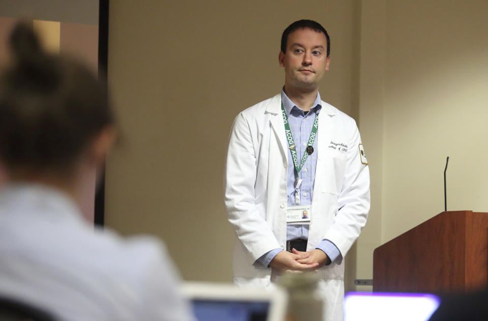 Dr. Keith Reisinger-Kindle, associate director of the OB-GYN residency program at Wright State University's medical school in Dayton, Ohio, leads a lecture of OB-GYN residents in the Wright State program Wednesday, April 13, 2022. The physician said his aim to boost abortion training “has been an uphill battle” because of legislative obstacles. (AP Photo/Paul Vernon)