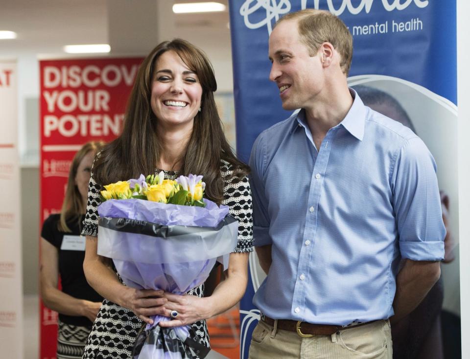 <p>Kate, holding flowers, laughs with Will at an event celebrating World Mental Health Day. <br></p>