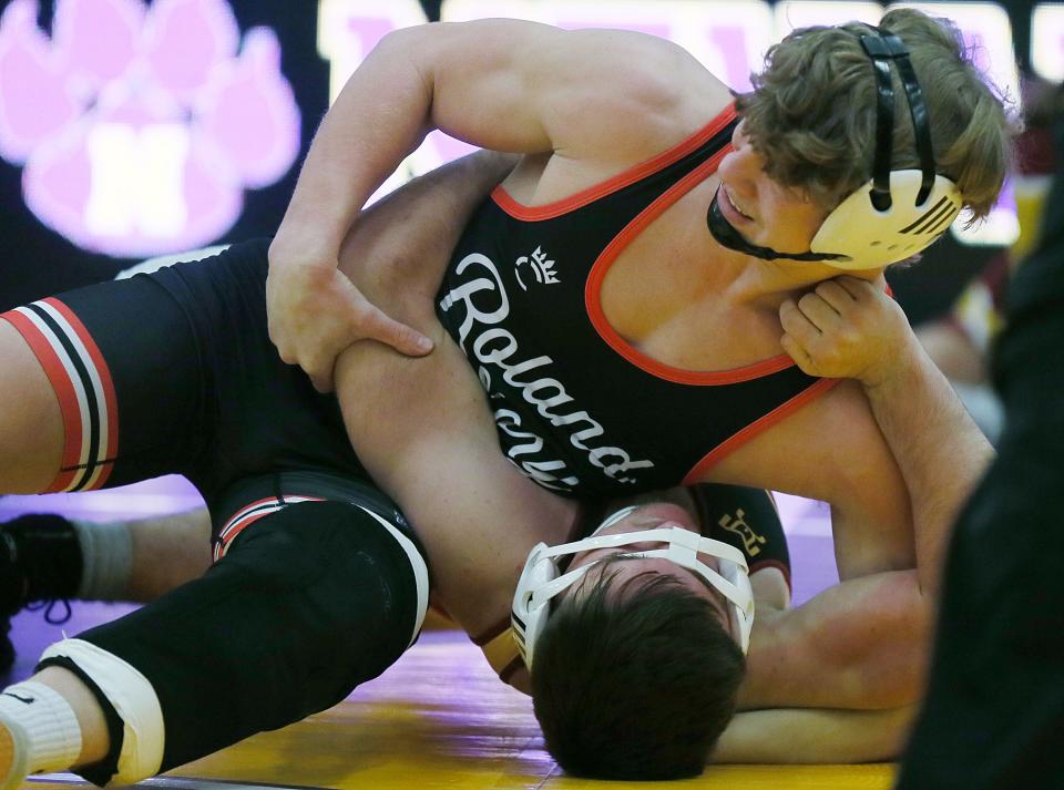 Roland-Story's Logan Powers works to pin Prairie City-Monroe's Jeffrey McDanel during their 165-pound bout at Nevada High School on Thursday. Powers pinned McDanel and is now 6-0 and ranked No. 7 in Class 2A by IAwrestle.com after missing all of last season with a knee injury.