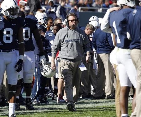 Penn State's offensive line and tight ends coach Bill Kenney walks on the sideline against Houston in the first half of the TicketCity Bowl football game in Dallas, Texas January 2, 2012. REUTERS/Tim Sharp