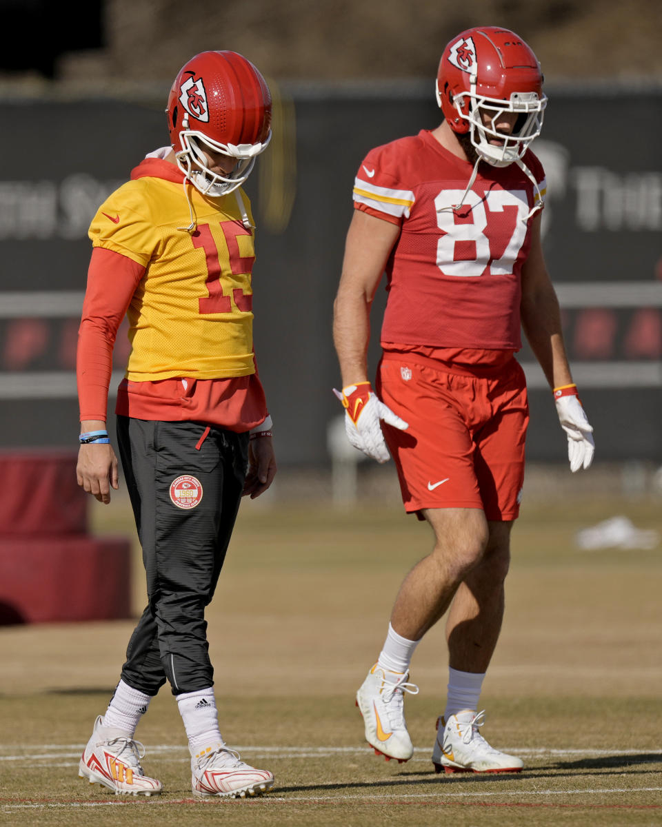 Kansas City Chiefs quarterback Patrick Mahomes (15) and Kansas City Chiefs tight end Travis Kelce (87) warm up during the team's NFL football practice Friday, Feb. 2, 2024 in Kansas City, Mo. The Chiefs will play the San Francisco 49ers in Super Bowl 58. (AP Photo/Charlie Riedel)