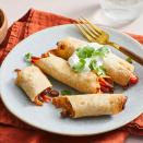 <p>These air-fryer taquitos are crispy on the outside with a warm and zesty chicken-and-bean filling on the inside. Pico de gallo, sour cream and fresh cilantro round out this easy recipe that's perfect for a game-day crowd. <a href="https://www.eatingwell.com/recipe/8025993/air-fryer-chicken-taquitos/" rel="nofollow noopener" target="_blank" data-ylk="slk:View Recipe;elm:context_link;itc:0;sec:content-canvas" class="link ">View Recipe</a></p>