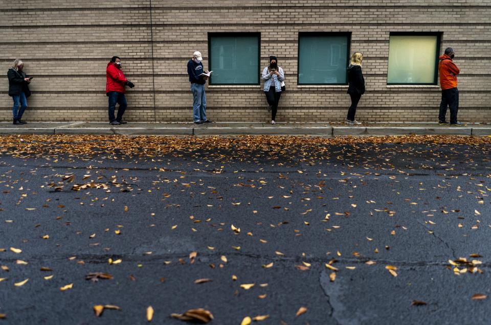 On the first day of early voting for the January 5th U.S. Senate runoff long lines of Georgia voters form. (Photo by Melina Mara/The Washington Post via Getty Images)