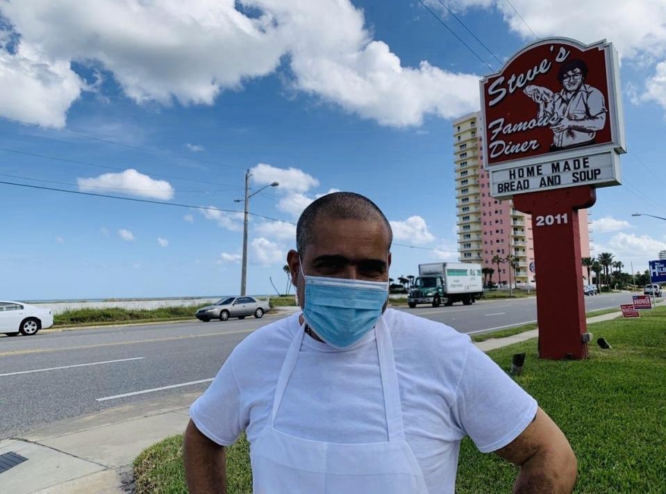 Christos Mavronas, the owner of Steve's Famous Diner at 2011 N. Atlantic Ave. in Daytona Beach, is seen here in late 2020, shortly after the vacant oceanfront lot across the street was sold to an Orlando investor group. That group sold the lot in November 2021 to another Orlando area developer for $5 million. The lot's new owner, Gelcorp Industries, now plans to develop a 29-story condo high-rise.