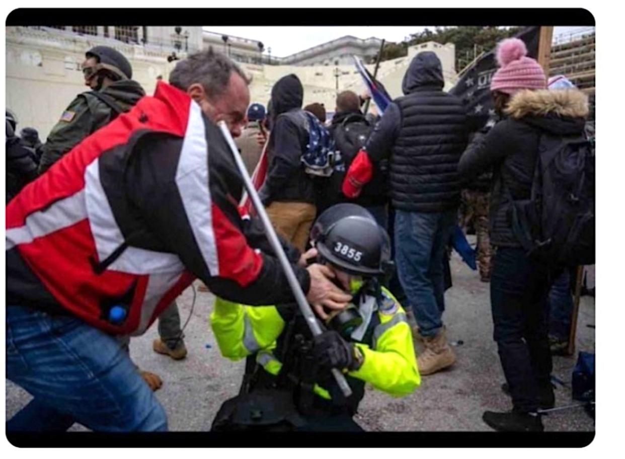 Tommy Webster is seen trying to dig his thumbs into the face of a police officer outside the Capitol on Jan. 6. (Photo: Department of Justice evidence photo of Tommy Webster in confrontation with police officer)