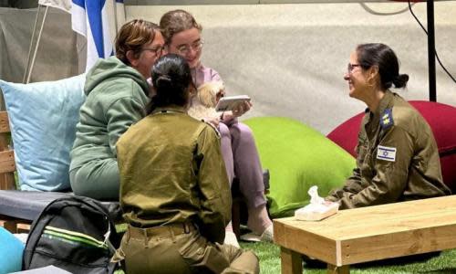 Mother and daughter Gabriela Leimberg and Mia Leimberg call their family shortly after their arrival in Israel.