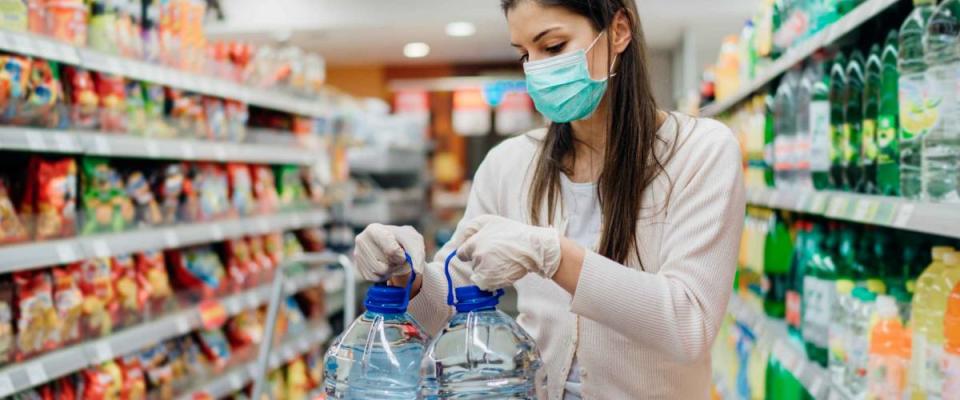 Buyer wearing a protective mask. Shopping during the pandemic.