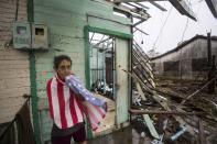 <p>A woman covers herself with a towel in front of damaged buildings in Punta Alegre, northern coast of Ciego de Avila province of Cuba after Hurricane Irma passed through the area on Sept. 11, 2017. (Photo: Yander Zamora/Anadolu Agency/Getty Images) </p>