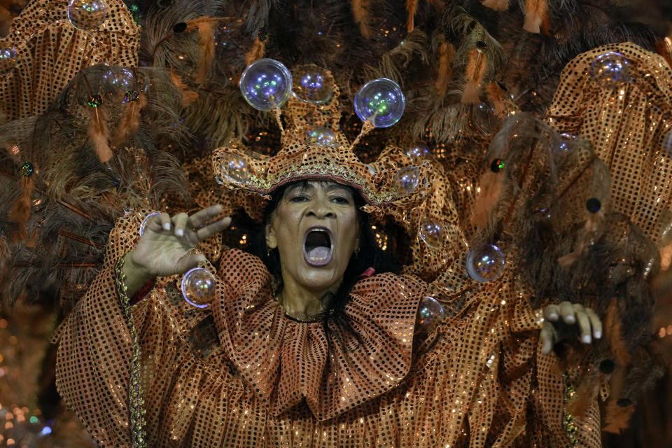 A dancer from the Academicos do Tatuape samba school performs during a carnival parade in Sao Paulo, Brazil, Saturday, Feb. 10, 2024. (AP Photo/Andre Penner)
