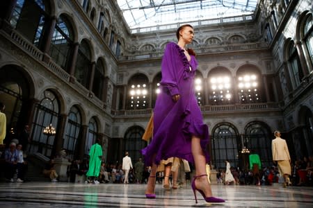 Models present creations during the Victoria Beckham catwalk show at London Fashion Week in London