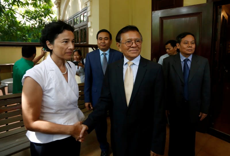 Leader of the CNRP Kem Sokha shakes hands with French Ambassador to Cambodia Eva Nguyen Binhin at his home in Phnom Penh