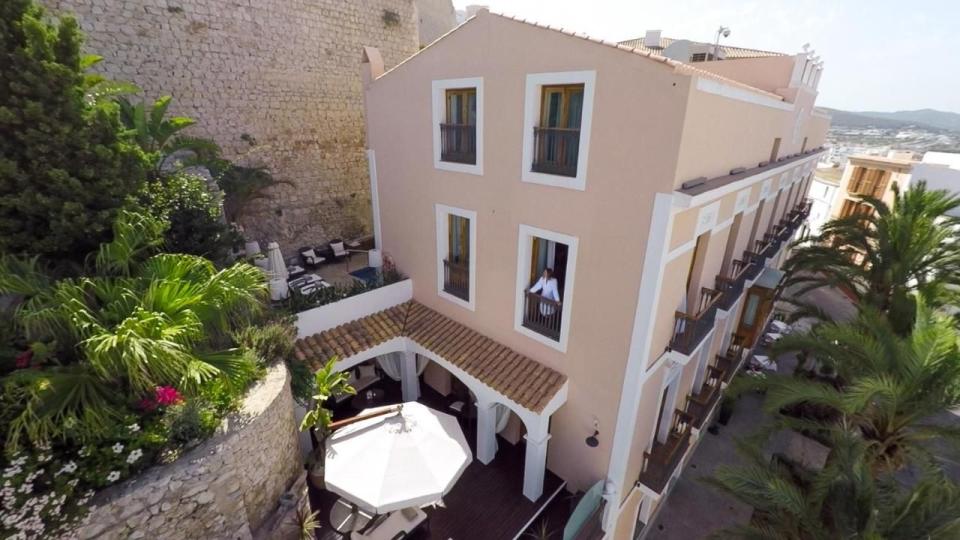 <p>One of the more traditional luxury hotels in Ibiza, the old-school <a href="https://www.booking.com/hotel/es/mirador-de-dalt-vila.en-gb.html?aid=2200765&label=luxury-ibiza-hotels" rel="nofollow noopener" target="_blank" data-ylk="slk:Mirador de Dalt Vila;elm:context_link;itc:0;sec:content-canvas" class="link ">Mirador de Dalt Vila</a> is a long way from those ungodly-hour raves. Trade those in for billowing drapes, silver breakfast trays, original artworks, period features and drinks under the shade on its palm-edged terrace. </p><p>The townhouse was built in 1904, within the city walls – the hotel’s name means ‘high-city lookout’, which is exactly what you’ll get: a viewpoint over the fortified old town.</p><p><a class="link " href="https://www.booking.com/hotel/es/mirador-de-dalt-vila.en-gb.html?aid=2200765&label=luxury-ibiza-hotels" rel="nofollow noopener" target="_blank" data-ylk="slk:CHECK AVAILABILITY;elm:context_link;itc:0;sec:content-canvas">CHECK AVAILABILITY</a></p>